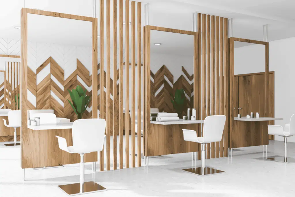 beauty salon interior design with a few white chairs and mirrors