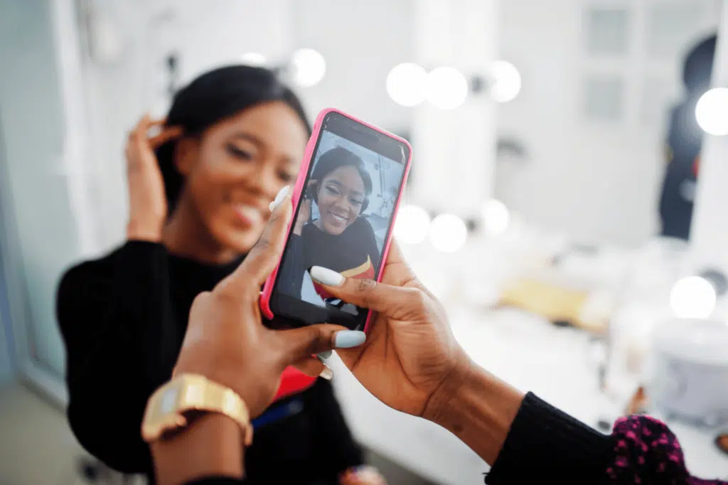 hairstyle being filmed by hairstylist phone