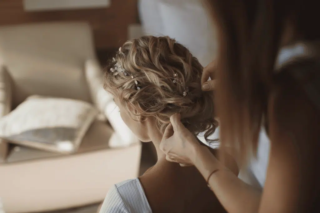 stylist preparing hair style for a special occasion or ceremony