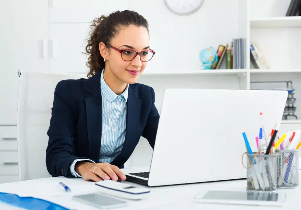 business woman using digital tools in her laptop