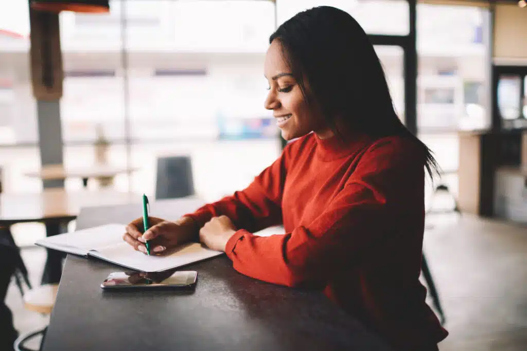 business owner setting goals with pen and paper