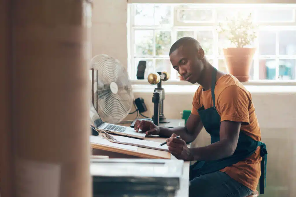 business owner setting goals for his new dressed in service provider attire 