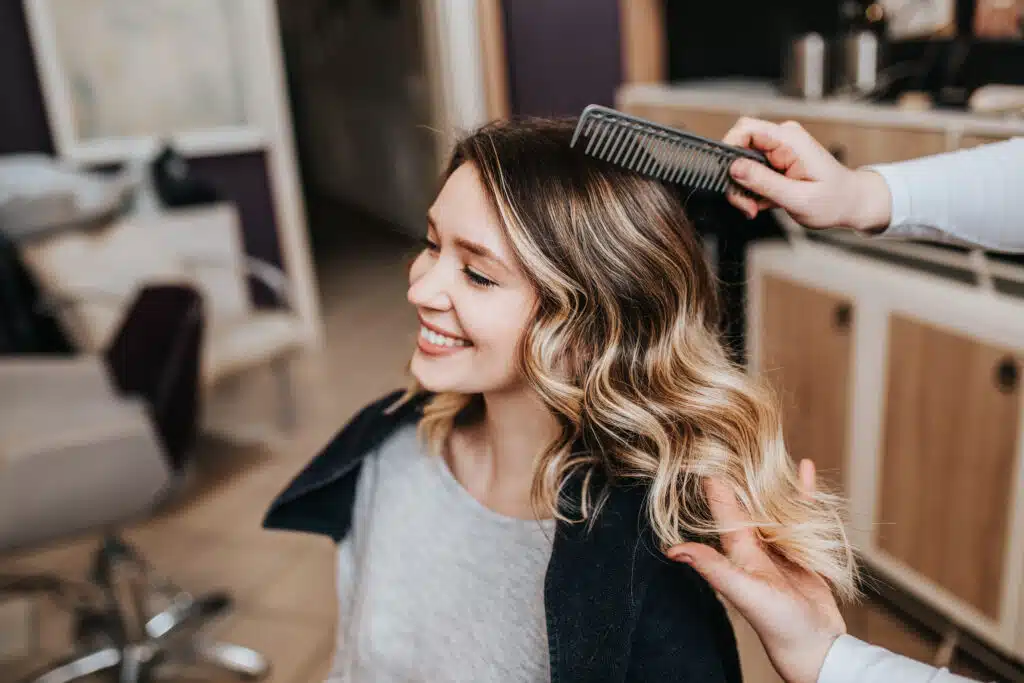 happy beauty salon customer smiling and satisfied 