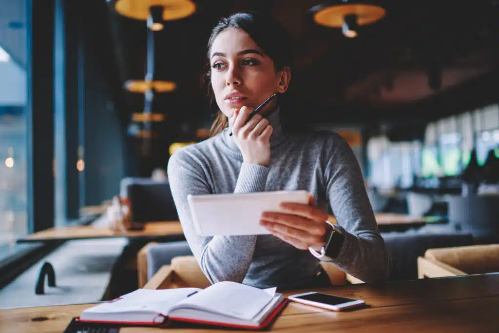 new business owner planning her next day of work inside an open space office