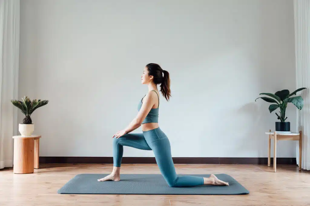 young business woman taking care of her health by doing yoga